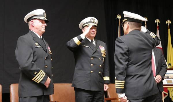 Capt. Howard Goldman , right, reports that he has assumed command of Naval Undersea Warfare Center (NUWC) Division Newport to Rear Adm. Michael Jabaley, commander of NUWC (center), as the former commander of NUWC Newport, Capt. Todd Cramer,  looks on.