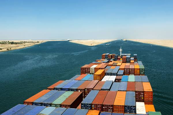 File Image: a boxship transits the suez Canal in better weather (CREDIT: © Andriy Kovach / AdobeStock)