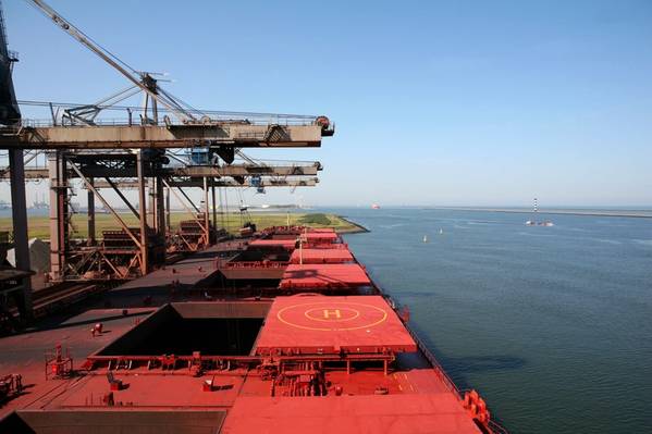 File Image: A Capesize bulker loads in port. CREDIT: AdobeStock / © Lidian Neeleman