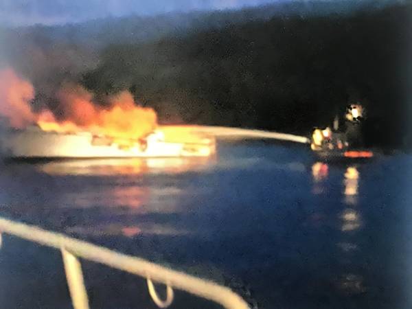 A USCG image of local responders fighting the fire on board the Conception.