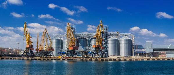 Lifting cargo cranes, ships and grain dryer in Sea Port of Odessa, Black Sea, Ukraine. Copyright Oleksandra/AdobeStock