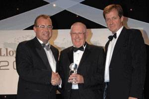 Maurice Storey, Honorary Chairman, Evergreen Marine (UK) accepts the Corporate Social Responsibility Award from Captain Henrik Kristensen, head of CSR at APM Terminals (left) and Alastair Campbell (right) .
