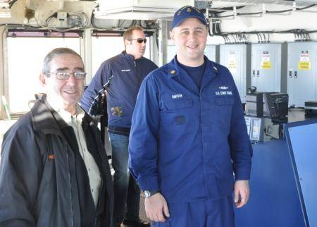 Petty Officer 1st Class Zachary Rafoth, a damage controlman aboard Coast Guard Cutter Mackinaw, gives a tour of the Mackinaw's bridge, Feb. 4, 2013. Rafoth was recently named the 2013 Coast Guard 9th District's Enlisted Person of the Year. (U.S. Coast Guard photo courtesy of Petty Officer 1st Class Zachary Rafoth)