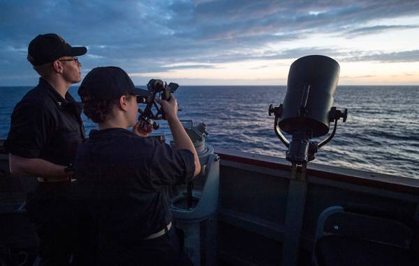 File photo: Two students from the U.S. Merchant Marine Academy train aboard the Arleigh Burke-class guided-missile destroyer USS Benfold in 2016. (Photo: Leigh Ellis / U.S. Navy)