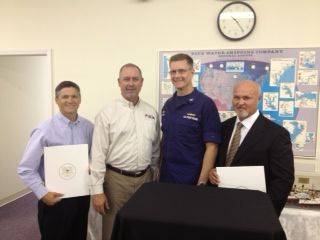 Pictured l-r: Captain Derek Solar, Captain Michael E. Rooney, USCG Captain P W Gautier, and Captain Maurice "Toby" Wattigney.