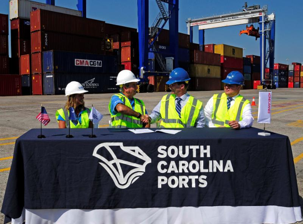 From left, SC Ports Authority Senior Vice President of Operations and Terminals Barbara Melvin and CEO Jim Newsome celebrate the purchase of 26 rubber-tired gantry cranes with Konecranes representatives Mika Mahlberg, Executive Vice President of Port Solutions and Jussi Suhonen, Regional Sales Director Americas, Port Solutions. (Photo: SCPA)