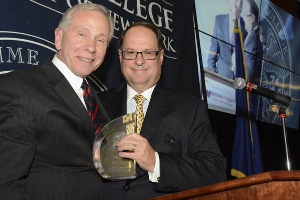 President and CEO of Bouchard Transportation, Morton S. Bouchard III accepts the Admiral’s Award from Maritime College Interim President Dr. Michael A. Cappeto at the Annual Admiral’s Scholarship Dinner on Tuesday, May 6, 2014