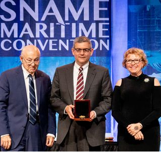 HII President and CEO Mike Petters, center, accepts the 2019 Vice Admiral Emory S. “Jerry” Land Medal from, at left, Fred Harris, former president of General Dynamics NASSCO and Bath Iron Works, and Suzanne Beckstoffer, president of Society of Naval Architect and Marine Engineers (SNAME). The Land Medal is presented to an individual for outstanding accomplishment in the marine field. Photo courtesy of SNAME