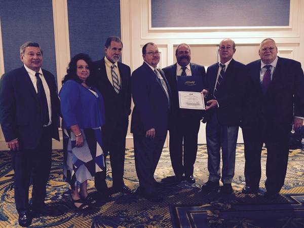 Left to right:  Crowley's Mike Golonka, vice president, ship management;  Rhonda Smith and Captain Andrew Smith; Captain Bob Cates; Dale Wilson, manager marine operations, petroleum services; Captain Charles Carlson and Captain Dennis O’Leary. (Photo: Crowley)