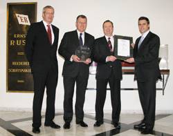 (from left to right): Dirk Lange, Germanischer Lloyd, Stefan Bülow, Reederei Ernst Russ, Jan Stahmer, Reederei Ernst Russ, and Matthias Ritters, Germanischer Lloyd, at the presentation of the "GL Excellence - 5 Stars" Certificate.