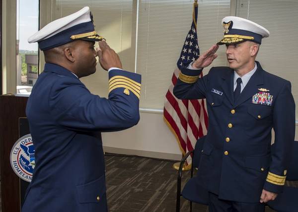Capt. Robert Smith, left, salutes Rear Adm. William G. Kelly, commander of Coast Guard Personnel Service Center, during Coast Guard Recruiting's change of command ceremony in Arlington, Va., Friday, July 10, 2015. During the ceremony, Smith relieved Capt. Ronald Labrec of command. (USCG photo by Michael De Nyse)