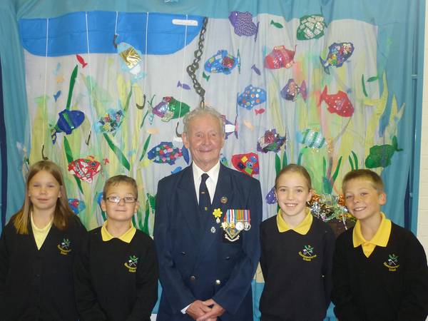  Royal Navy Veteran Roy Ticehurst with pupils from Woodmansterne Primary School Helen Marshall, James Stephenson, Azura Stones and Dylan Brown, all aged 11