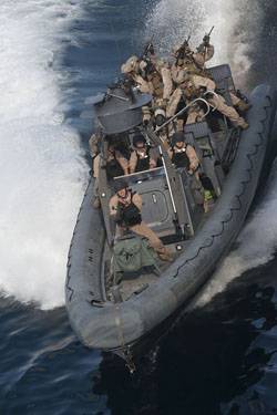 Sailors assigned to the USS New Orleans (LPD 18) operate a rigid-hull inflatable boat during a practice mission with the 11th Marine Expeditionary Unit (11th MEU) Maritime Raid Force.