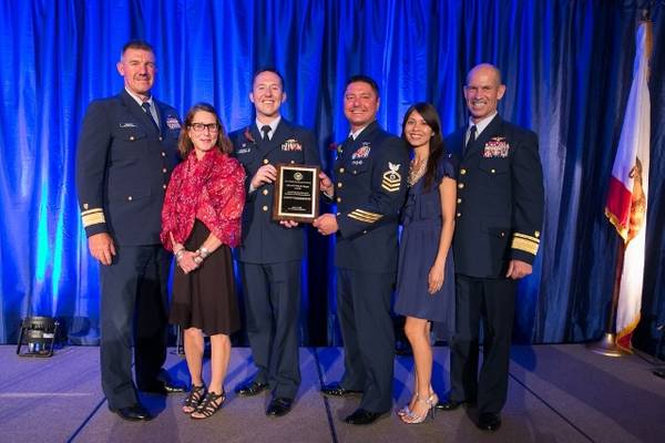 From left: R.Adm. Karl Schultz, Paige Vincent, Lt. Nathan MacKenzie, MKC Anthony Harris, Maria Harris, V.Adm.-Select Charles Ray.