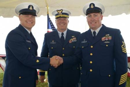 Senior Chief Petty Officer Eric Best (left) assumed command of Coast Guard Station Montauk from Senior Chief Petty Officer Jason Walter (right) during a change of command and retirement ceremony held in Montauk. Capt. Edward J. Cubanski (middle), commander of Coast Guard Sector Long Island Sound, presided over the ceremony. (USCG photo by Ali Flockerzi)