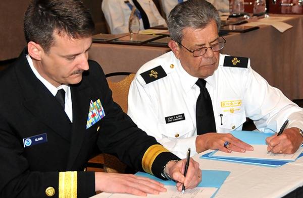 Signing the Agreement: Photo credit NOAA
