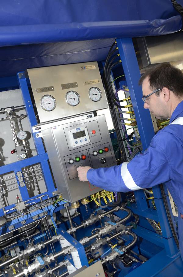 EFC Technician at work on Hydraulic Power Unit (HPU) at EFC Forres manufacturing facility