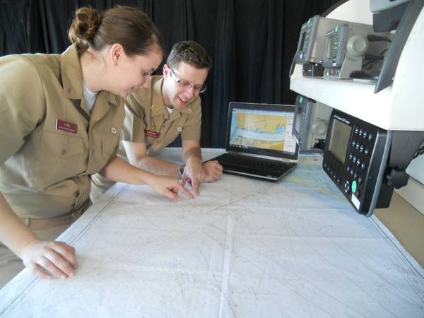 Texas A&M students, Holly Ball and Nicholas Mogensen, seniors in the Marine Transportation Department, train with Rose Point Navigation ECS software on the bridge of the academy ship, General Rudder.