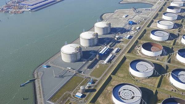 The three grey LNG tanks are located next to the water side - 4th LNG tank will be constructed next to these tanks. Photo: Aeroview