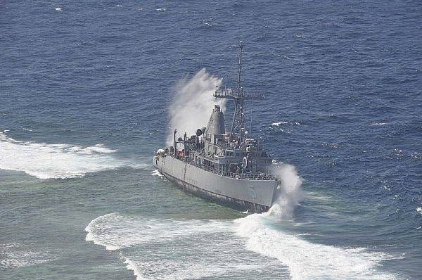 Waves Break Over USS Guardian: Photo credit USN