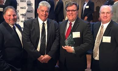 Buck Younger, third from left, was named the Marine Engineer/Naval Architect of the Year. Attending the awards presentation were VT Halter Marine’s Alvin Erkhart, Vice President of Production, Kevin Amis, Executive Vice President of Operations, and Rob Mullins, Deputy President. (Photo: VT Halter)