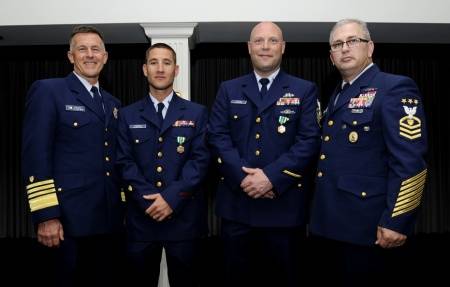Adm. Paul Zukunft, Petty Officer 2nd Class Giacomo Terrizzi, Chief Petty Officer Ryan Olson, and Master Chief Petty Officer of the Coast Guard Steven Cantrell (U.S. Coast Guard photo by Kyle Niemi)
