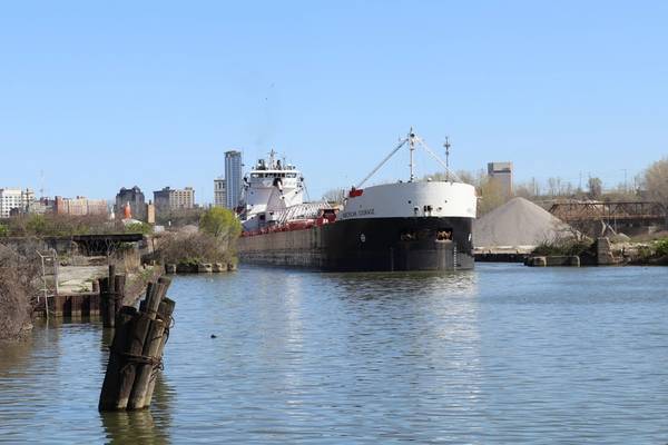 American Steamship Company’s M/V American Courage upbound on the Cuyahoga River in Cleveland, Ohio with a load of taconite from the iron ranges on Lake Superior for ArcelorMittal Cleveland, one of the most productive integrated steel mills in the world. (Photo Credit: Thomas Rayburn)