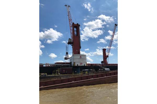 Associated Terminals & Turn Services run an impressive mid-stream cargo transfer operation in the Mississippi River. Historically high waters and swift currents in this critical waterway challenge the speed, efficiency and safety of all river-borne operations. Photo: Greg Trauthwein