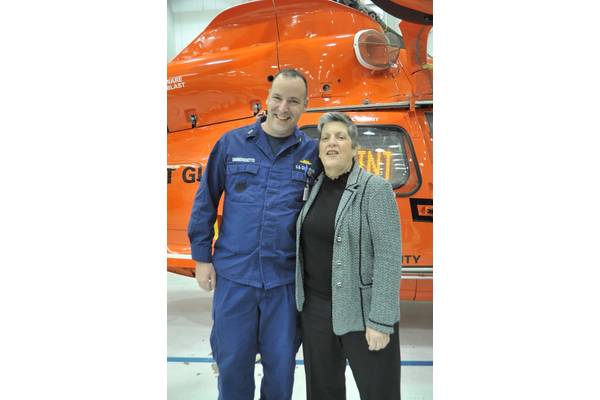 Chief Warrant Officer Richard Sambenedetto poses with Department of Homeland Security Secretary Janet Napolitano at Coast Guard Air Station Atlantic City, N.J., Friday, Jan. 20, 2012. Sambenedetto served as the contracting officer within the air station’s supply department. (U.S. Coast Guard photo by Petty Officer 3rd Class Cynthia Oldham)