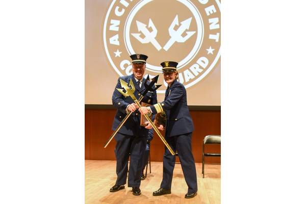 U.S. Coast Guard Rear Admiral Linda Fagan and Master Chief Petty Officer Richard “Shane” Hooker pose after being recognized as the first Ancient Tridents (U.S. Coast Guard Photo by Frank Iannazzo-Simmons)