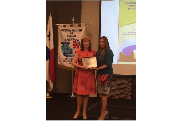 Cynthia A. Hudson (left) accepts the CIP/OAS award for Outstanding Woman in Port Protection and Security from Meredith Pinedo, Chief of Control and Compliance Department, Maritime Authority of Panama (Photo: HudsonAnalytix)