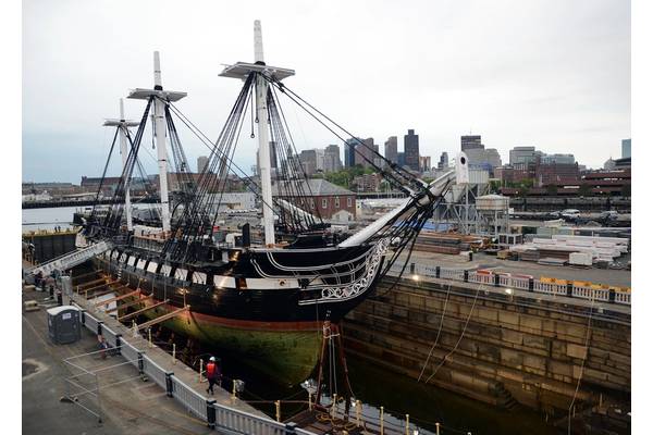 The entire hull of USS Constitution is exposed for the first time in 19 years as Dry Dock 1 in Charlestown Navy Yard is dewatered. Constitution entered the dock last night to commence a multi-year planned restoration period.