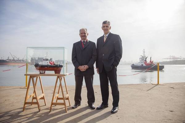 (left) Louis Gontier, Chief Operations Officer of Southern African Shipyards and (right) Nico Walters, General Manager: Strategy of Transnet National Ports Authority during the official handover of the Port of Durban’s new Umbilo tug from the ship builder to the Authority. (Photo: TNPA)