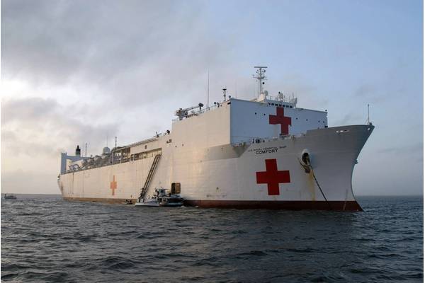 Military Sealift Command hospital ship USNS Comfort (T-AH 20) is anchored off the coast of Puerto Barrios, Guatemala, during a scheduled stop on a four-month humanitarian deployment to Latin America and the Caribbean to provide medical treatment to patients in a dozen countries. While deployed, Comfort is under the operational control of U.S. Naval Forces Southern Command and tactical control of Destroyer Squadron (DESRON) 24. US Navy Photo