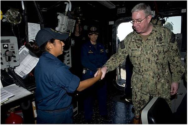 Vice Adm. John W. Miller congratulates Boatswain's Mate Seaman Erika Miranda Alvarez on her selection as Carrier Strike Group (CSG) 11's Blue Jacket of the Quarter aboard the guided-missile destroyer USS William P. Lawrence (DDG 110). (U.S. Navy photo by Carla Ocampo)