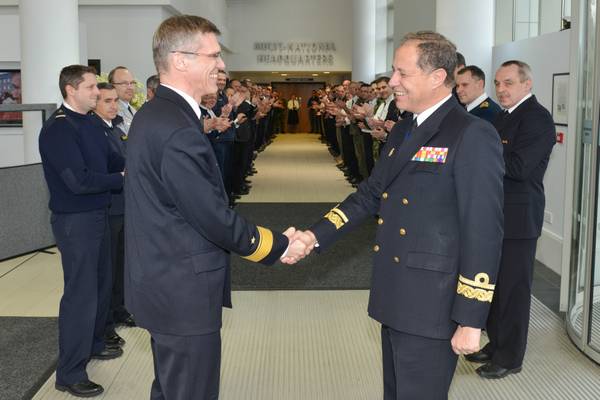 Outgoing DCOM Rear Admiral Martens shakes hands with incoming DCOM Rear Admiral Bauzá as the Operational HQ staff applaud (Photo courtesy EU NAVFOR)