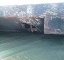 Photos of damage to the barge CBC 7026 and barge TTI-150 after they collided near mile marker 341 in the Intracoastal Waterway, Dec. 23, 2013. U.S. Coast Guard photo.  