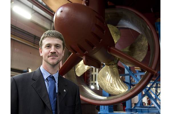 Project Manager, Oscar Kallerdahl stand beneath the second LNG tug, which will be delivered early next year.