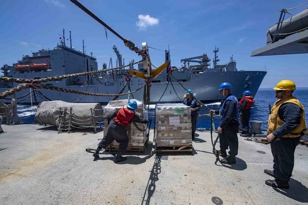 Sailors secure cargo aboard the Arleigh Burke-class guided-missile destroyer USS McCampbell (DDG 85) during a replenishment-at-sea with the dry cargo and ammunition ship USNS Ameilia Earheart (T-AKE 6). McCampbell is forward-deployed to the U.S. 7th Fleet area of operations in support of security and stability in the Indo-Pacific region. (U.S. Navy photo by Mass Communication Specialist 3rd Class Isaac Maxwell)