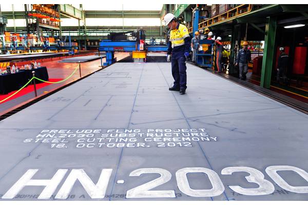 Shell celebrates the first steel cut for the first steel cut for the game-changing Prelude floating liquefied natural gas project’s substructure. The sheet of steel to be cut weighs 7.6 tonnes, is 4.3 metres wide, 13.8 metres long and 16.5 millimetres thick. (Photo: Shell)   