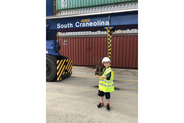 Jack Sibley-Jones, a fifth grader at Blythe Academy, visits Inland Port Greer to see the rubber-tired gantry crane he named “South Craneolina" as part of the Port's crane-naming contest.

