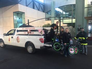 SFFD volunteers loading toys and bikes (Photo: SFBP)
