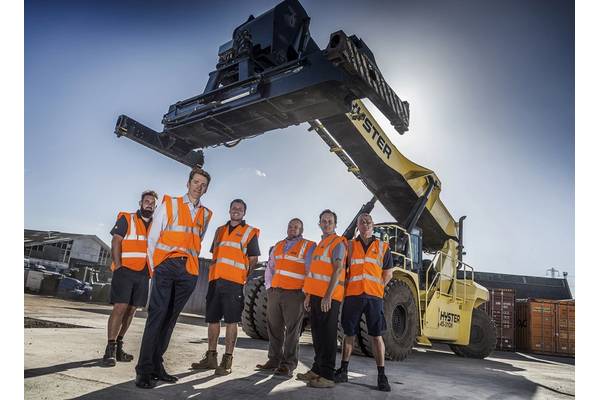 Williams Shipping's cargo handling team with their new reach stacker in new one-acre yard at the firm’s Millbrook headquarters in Southampton. (Photo: Williams Shipping)
